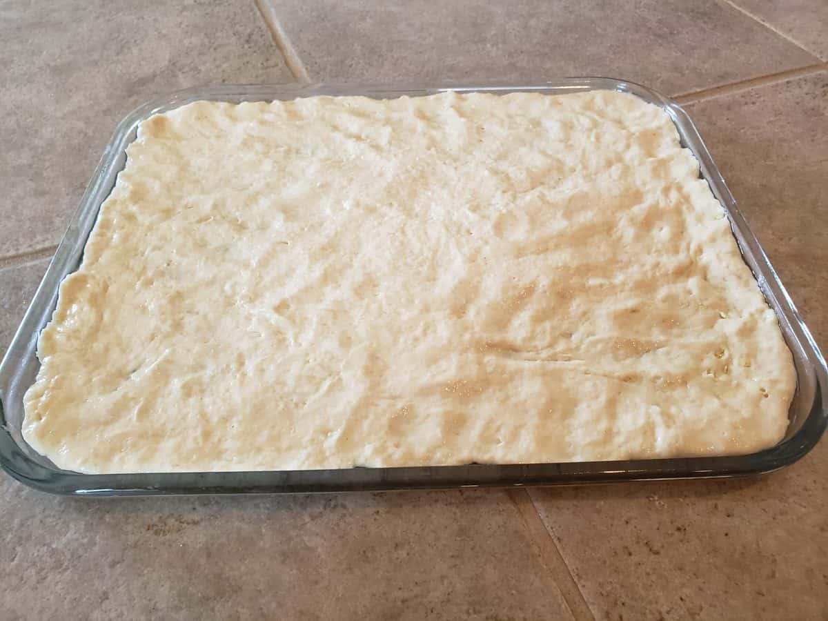 Unbaked pizza dough for sheet pan pizza recipe (store bought dough).