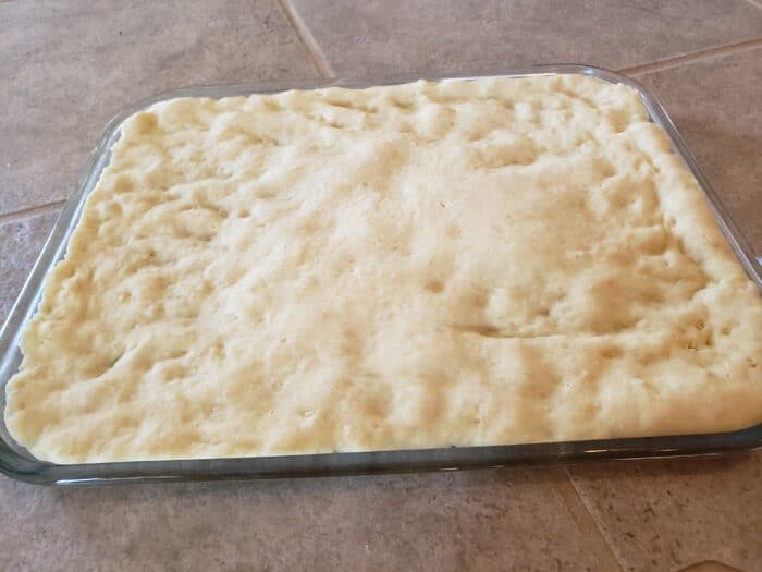 pizza dough baked for three minutes