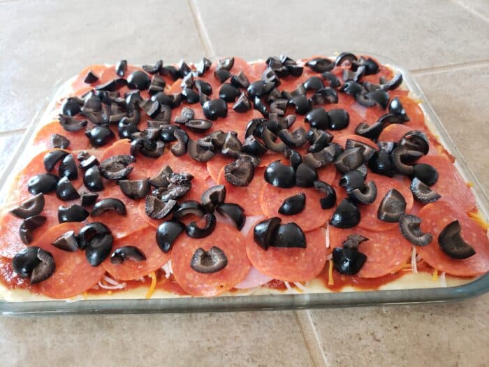 black olives added and ready to put in the oven