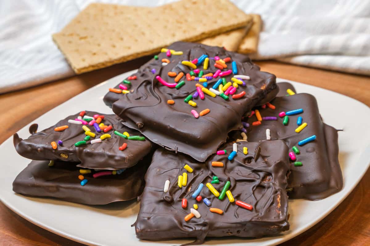 Chocolate covered graham crackers on a plate.