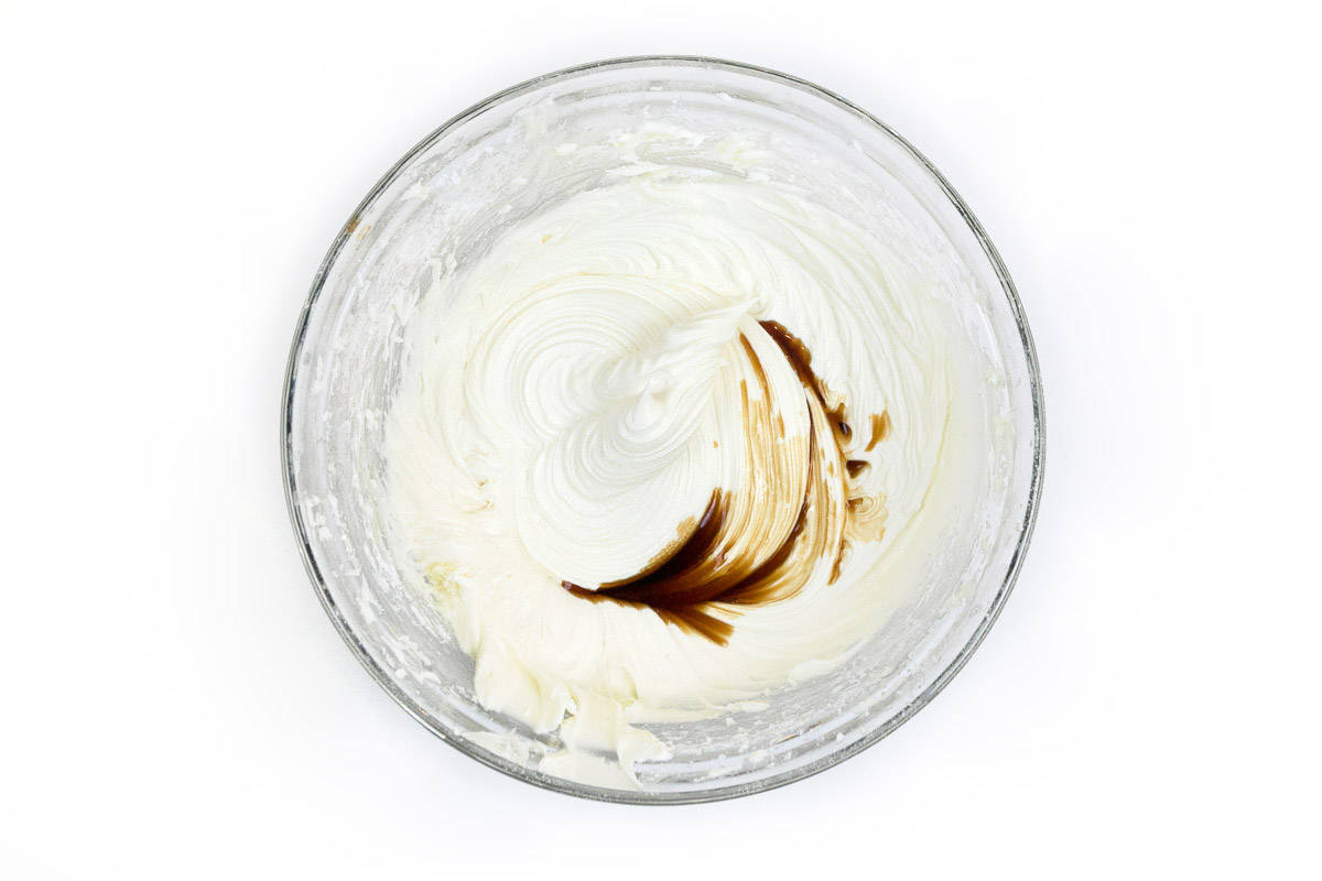 The vanilla extract is added together with the frosting.