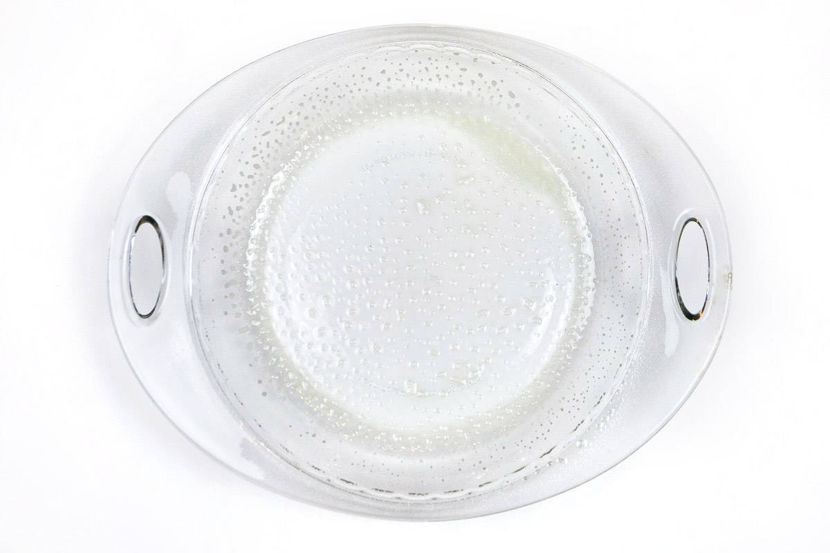 A pie dish sprayed with non-stick cooking spray.