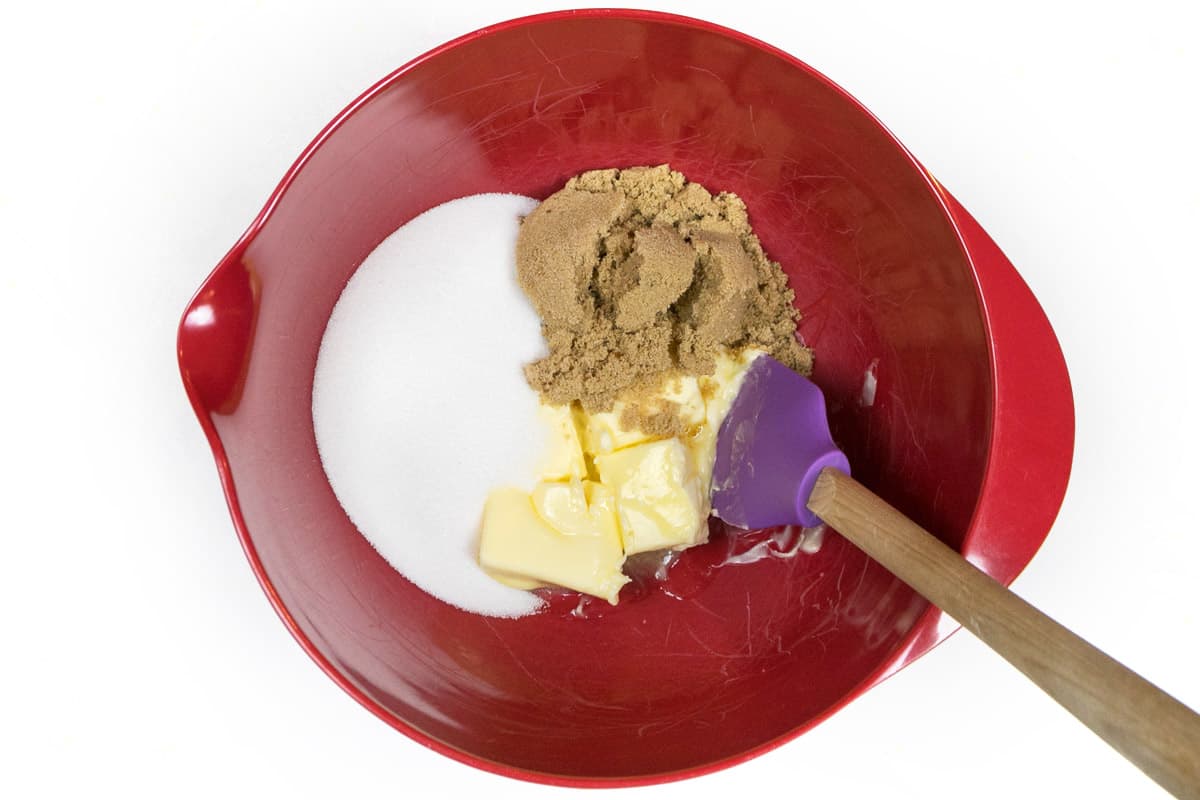 Softened butter, granulated sugar, and light brown sugar in a bowl.
