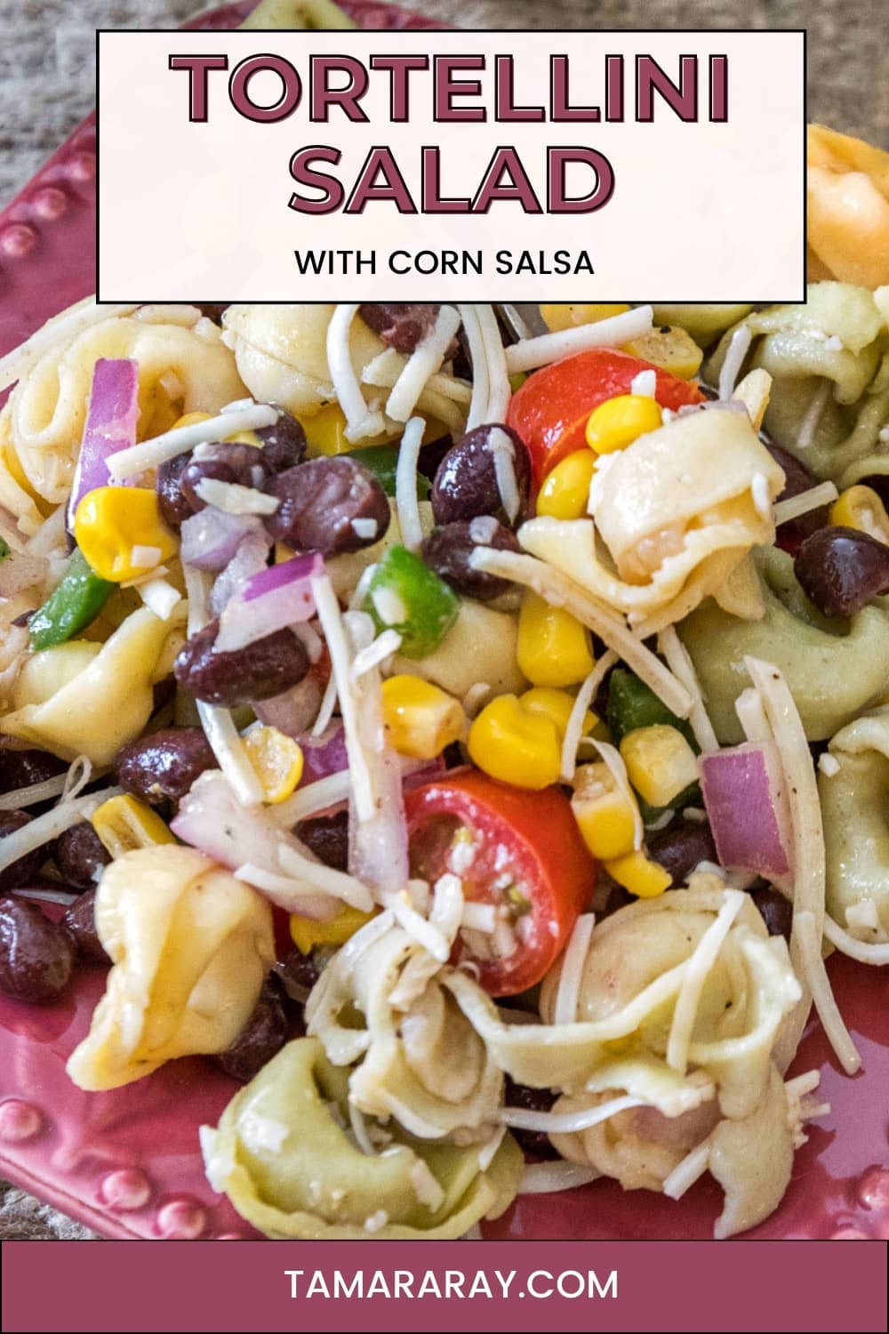 A serving of summer tortellini salad with corn salsa on a plate.