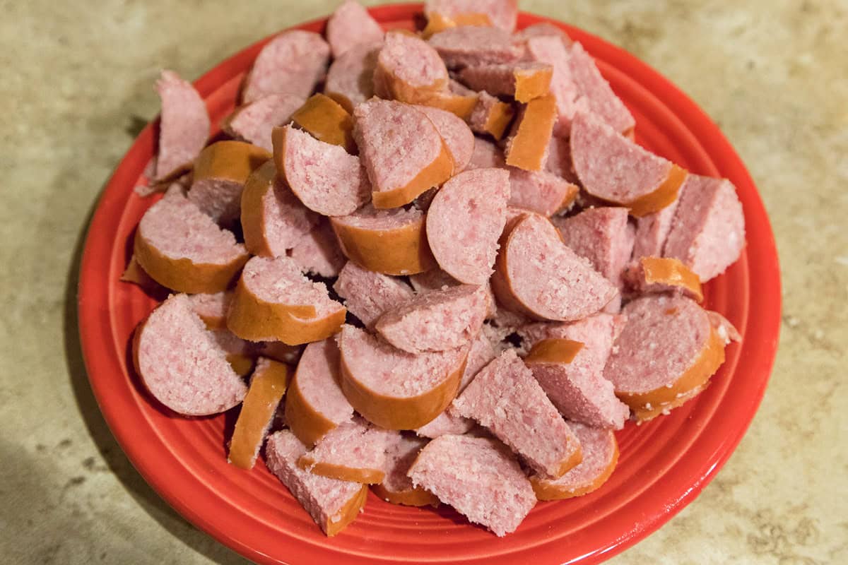 Cut up beef Polska kielbasa on a plate.