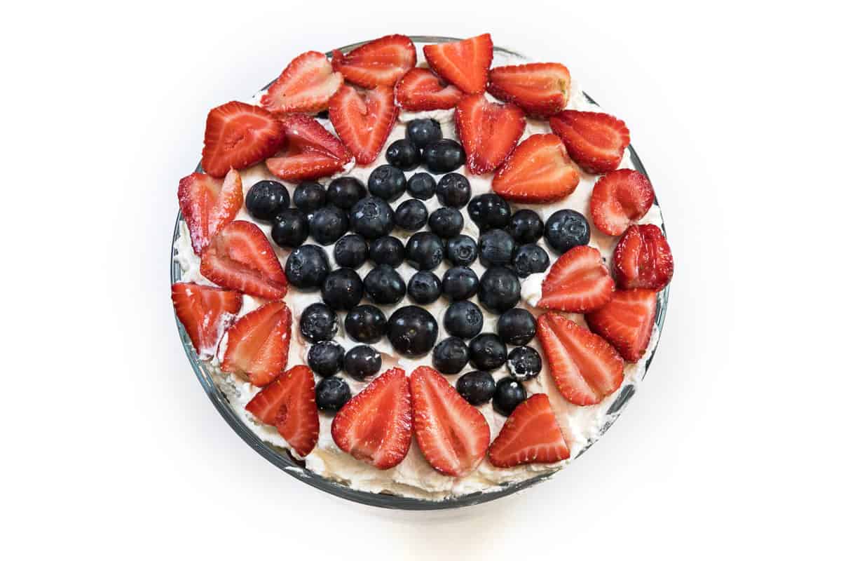 Strawberries and blueberries on top of the 4th of July trifle dessert.