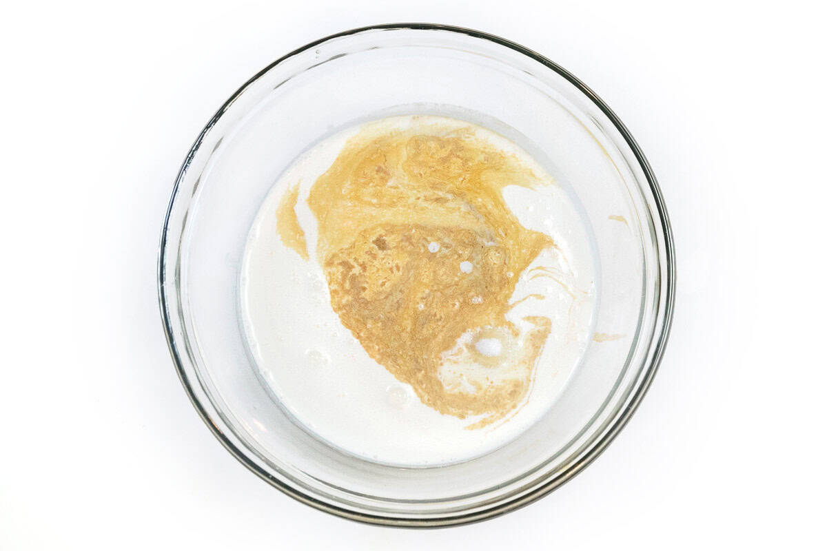 Whipping cream, sugar, and vanilla extract in a bowl.