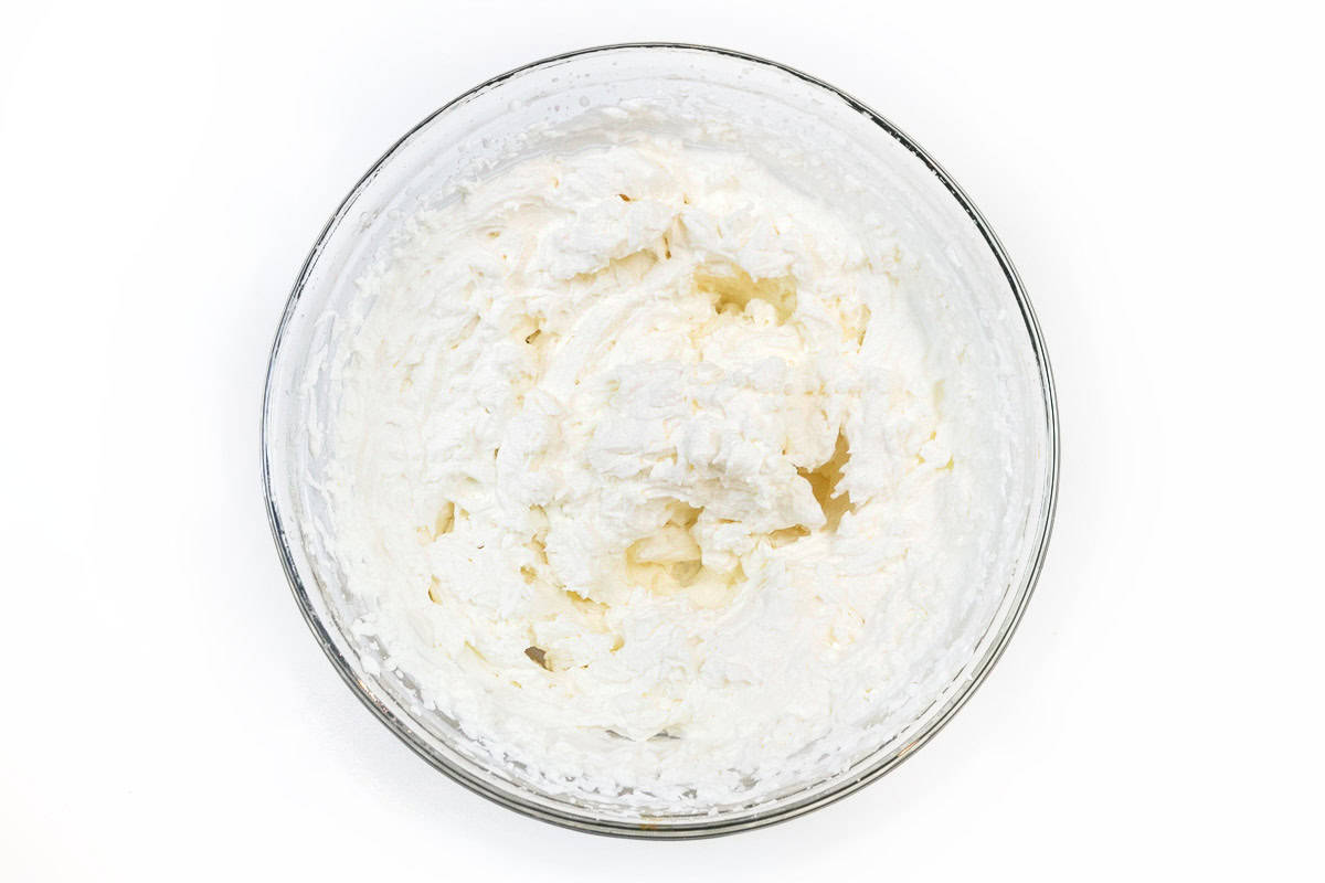 Homemade whipped cream in a bowl.