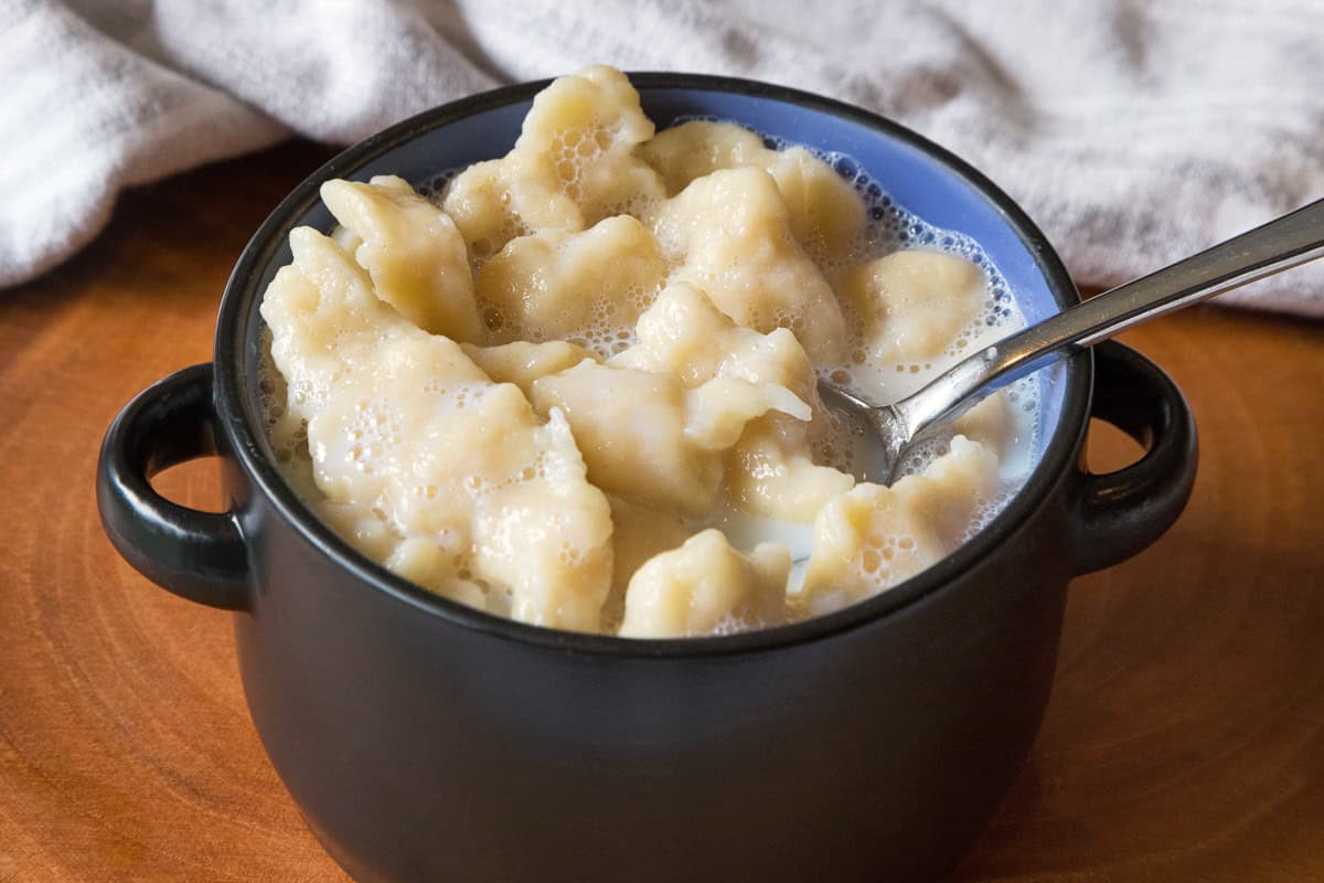 Milk soup with dumplings in a bowl.