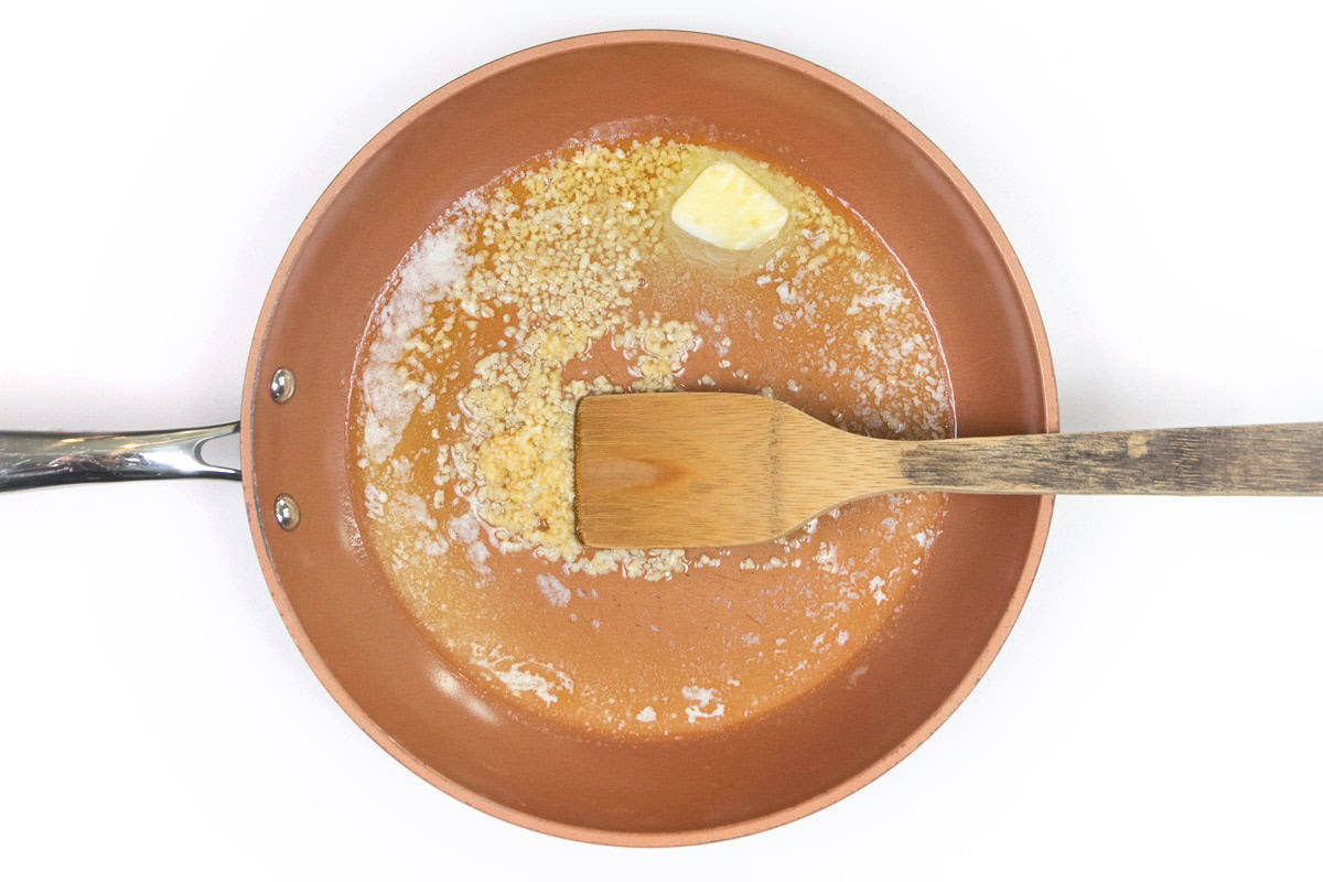 Minced garlic and unsalted butter in a skillet.