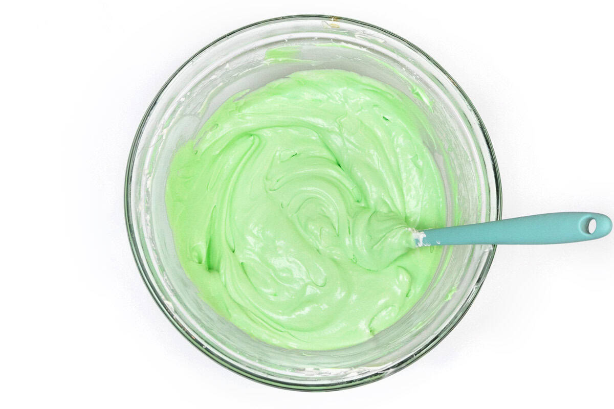 The green food coloring is blended together with the whipped cream and cream cheese mixture.