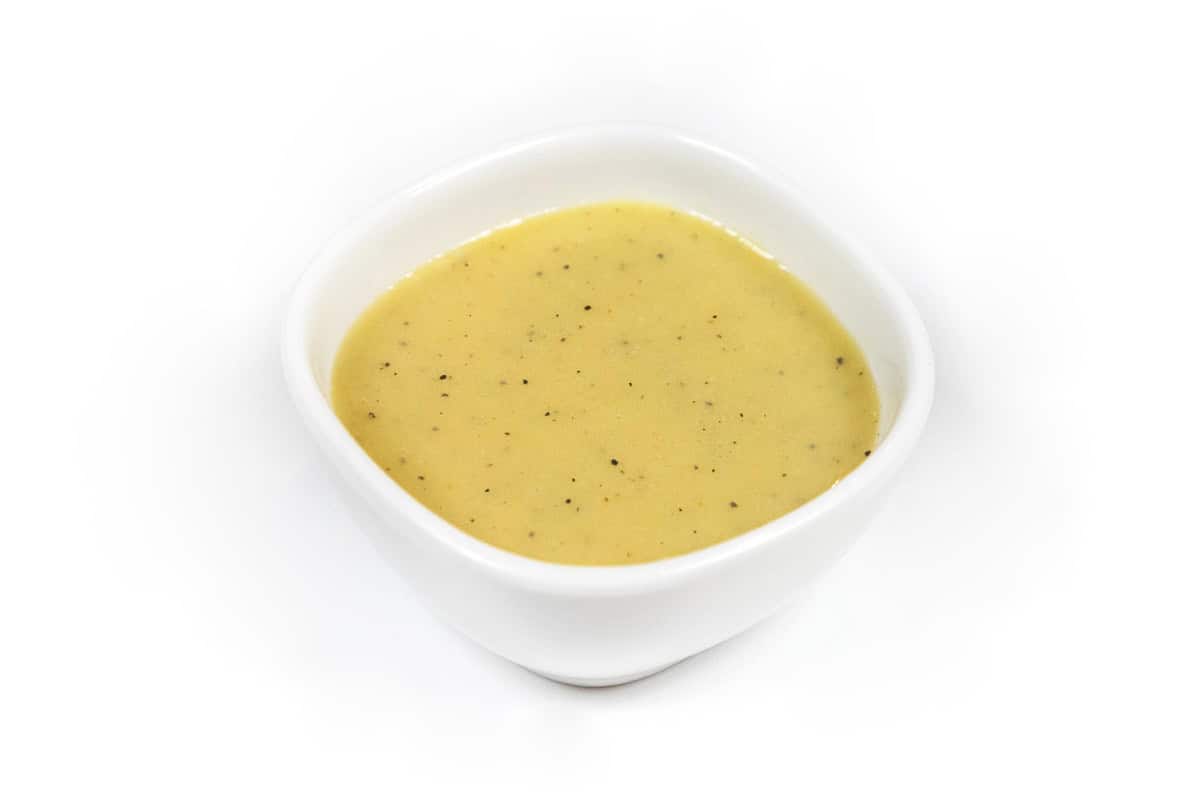Greek yogurt honey mustard dressing in a bowl.
