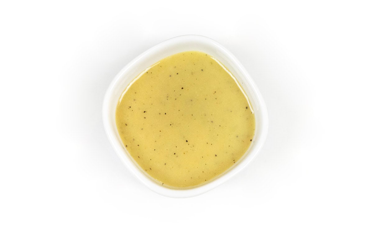 Greek yogurt honey mustard dressing in a bowl.