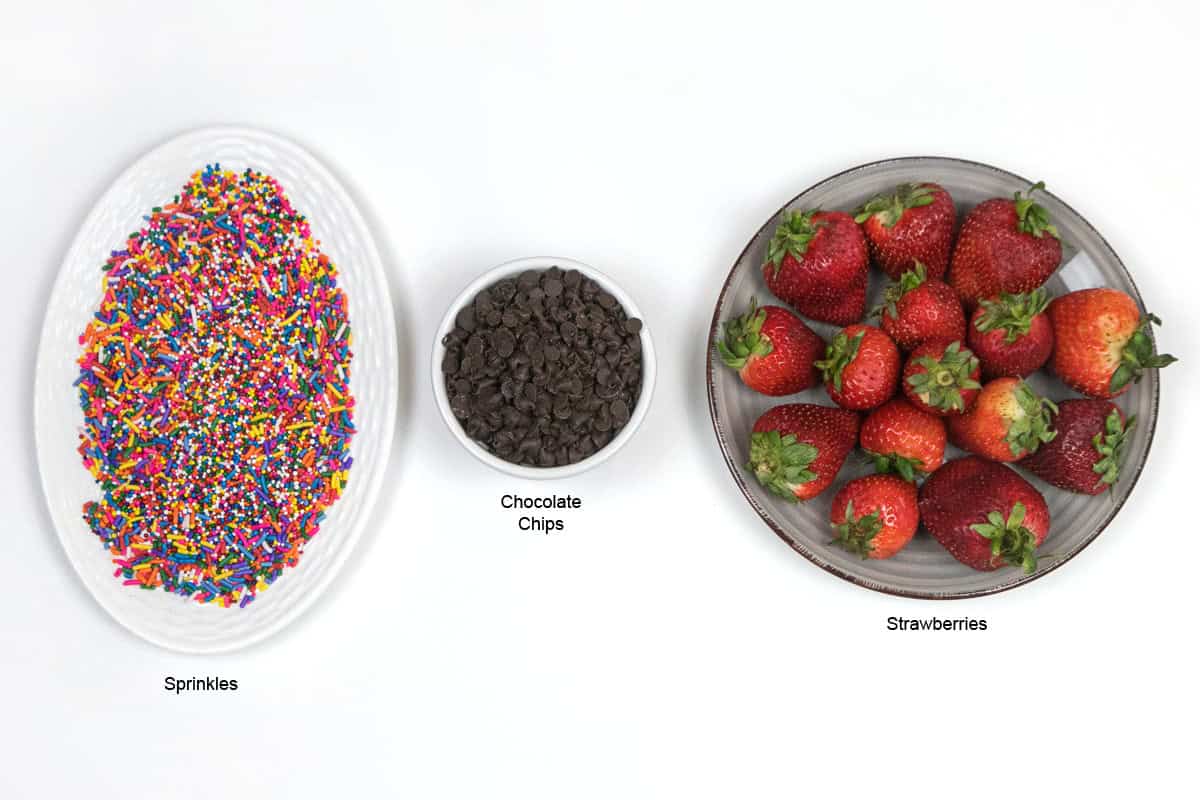 Ingredients for chocolate covered strawberries with sprinkles.