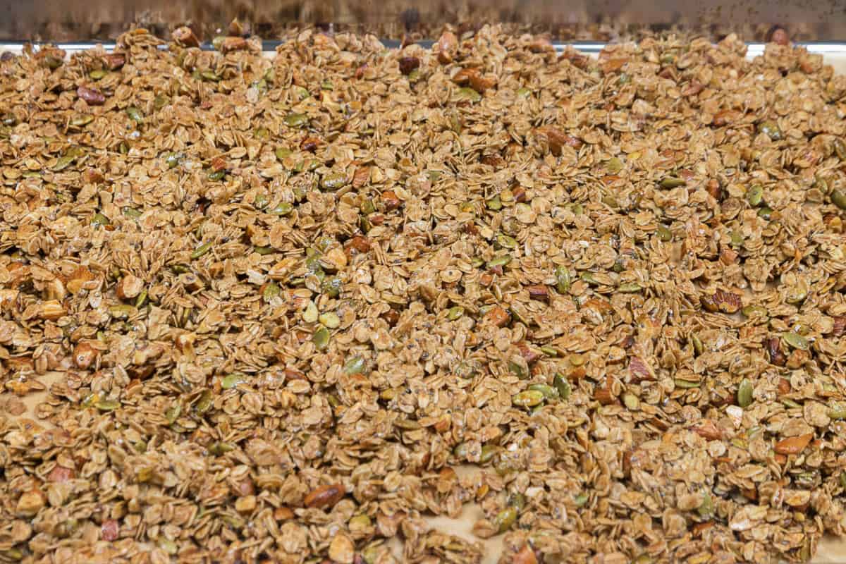 A close shot of almond granola with honey.