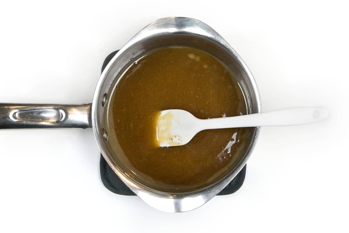 Melt the unsalted butter, brown sugar, honey, and vanilla bean paste in a saucepan.