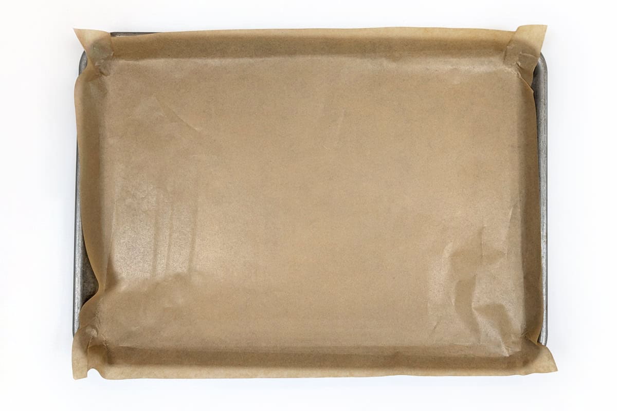 Cookie sheet lined with parchment paper.