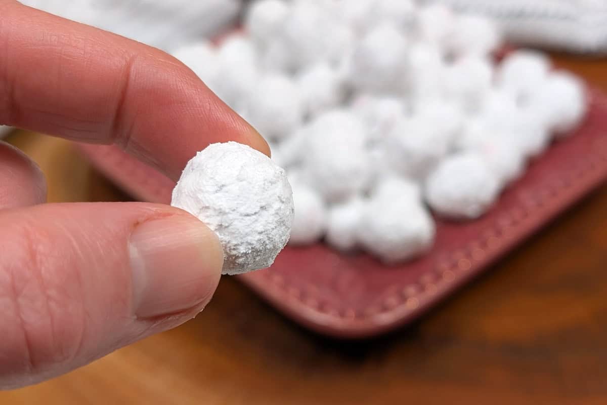 A close up shot of a popping candied cranberry.