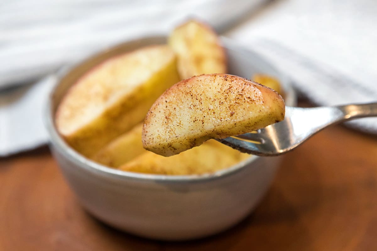 Air fryer apples in a bowl.