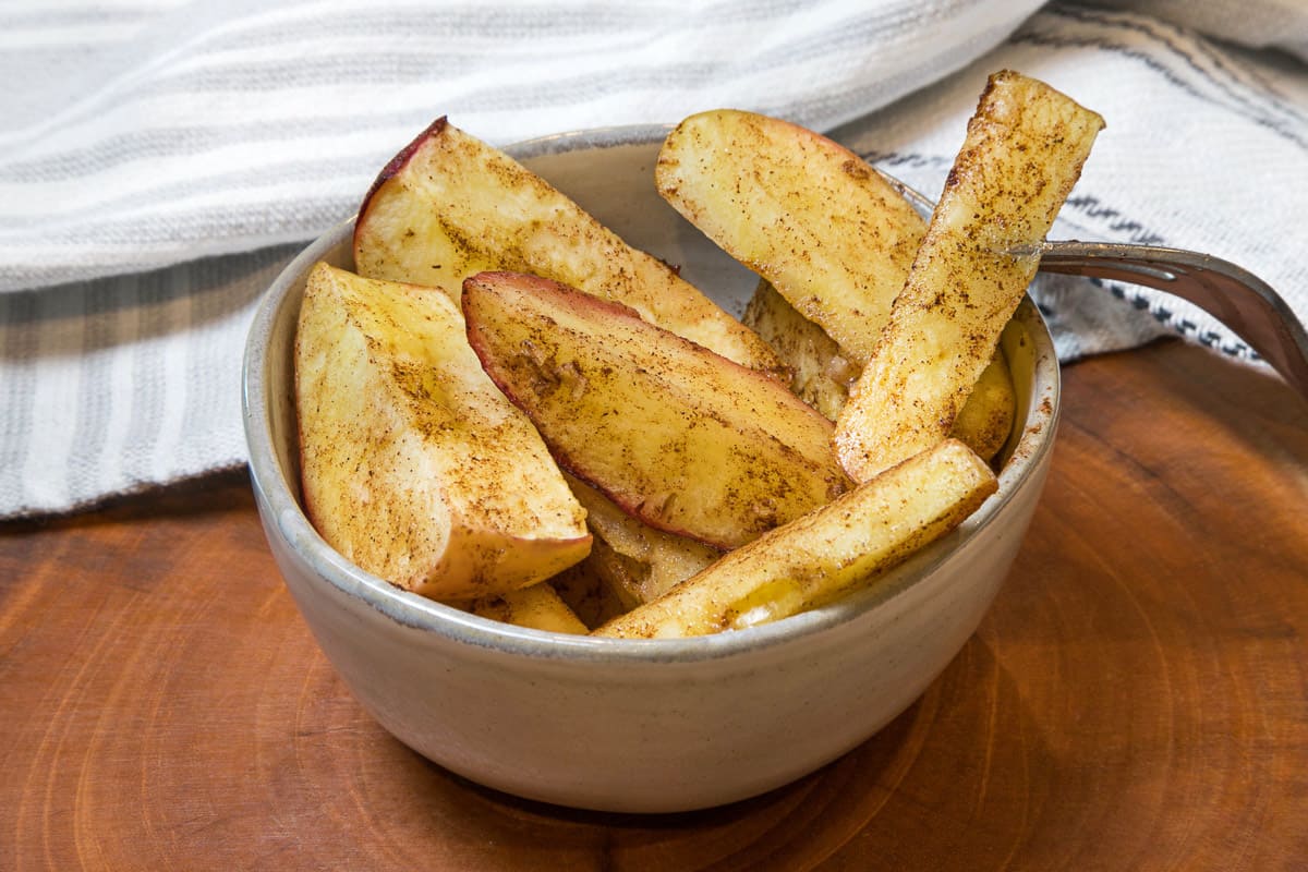 Air fryer apples in a bowl.