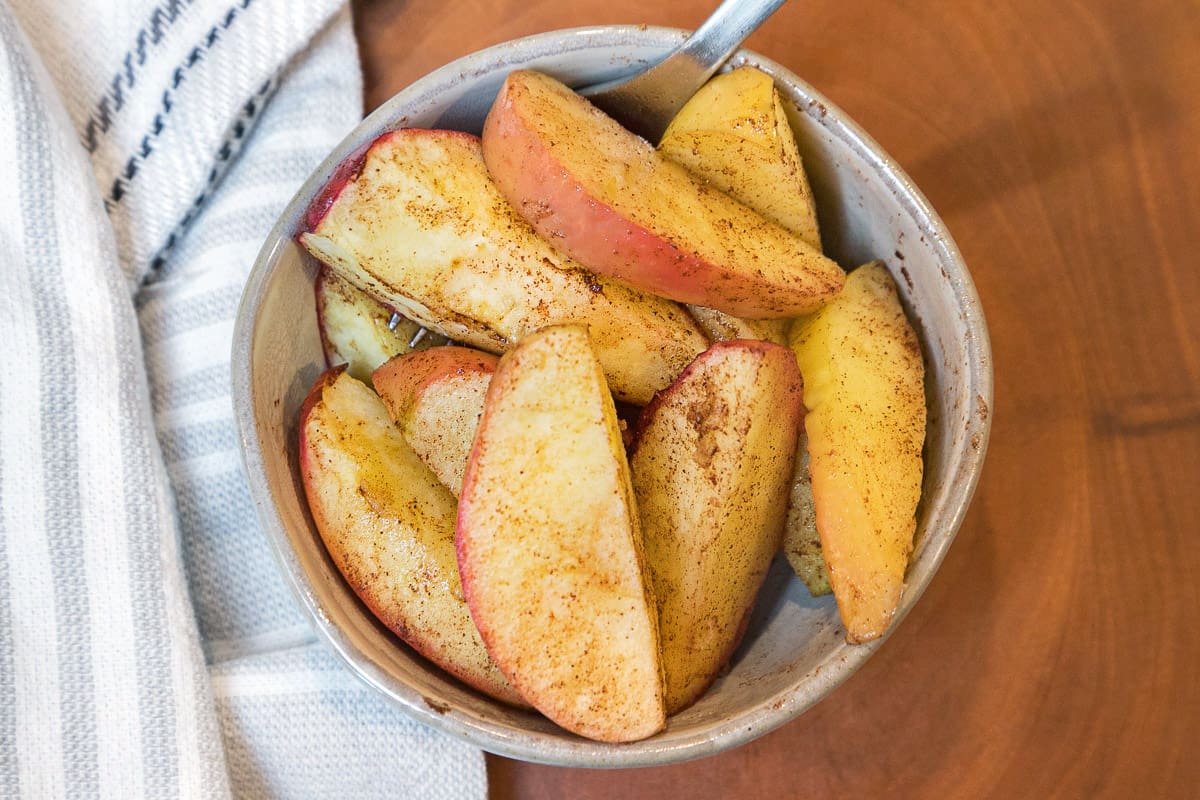 Air fryer apples in a bowl.