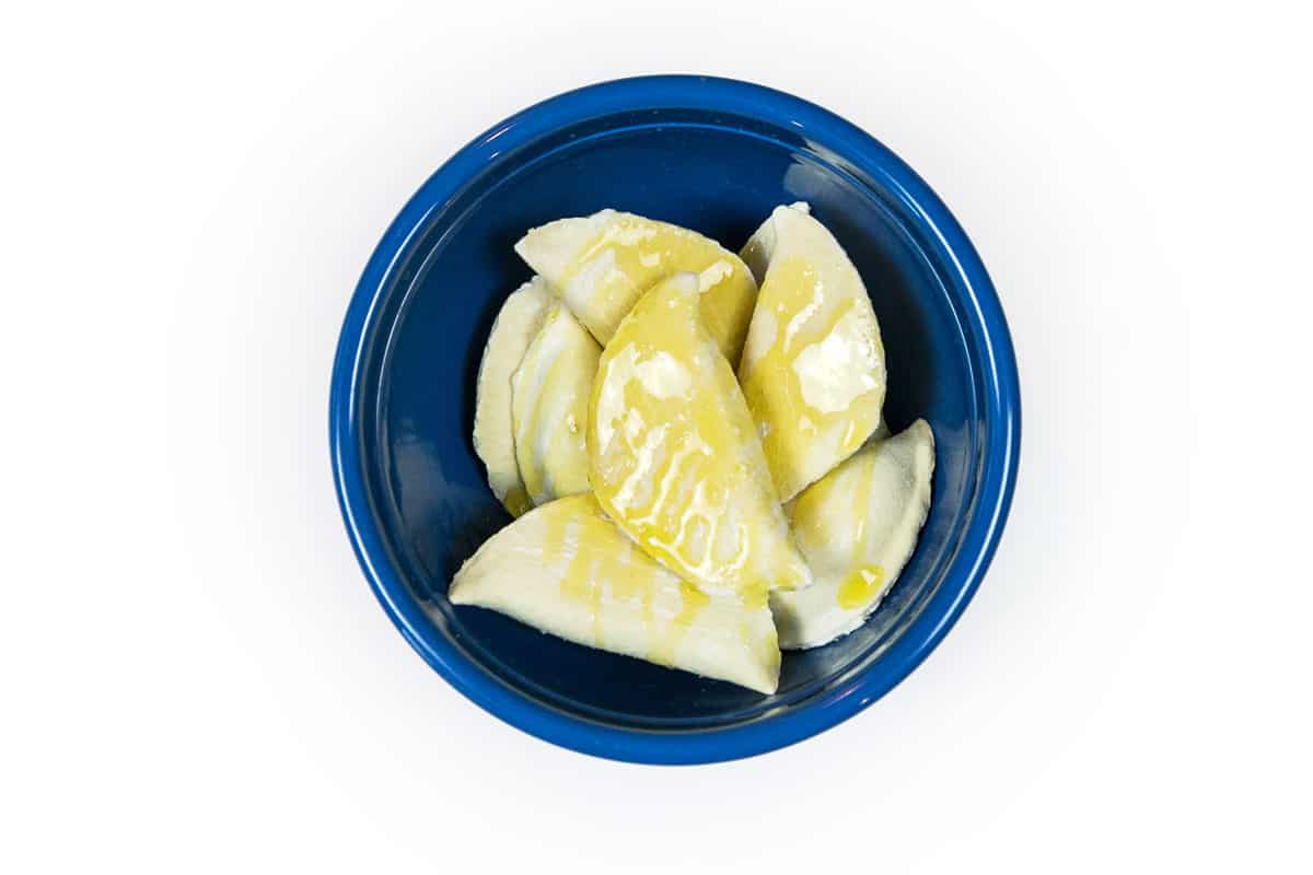 The potato and cheese pierogies are brushed with olive oil.