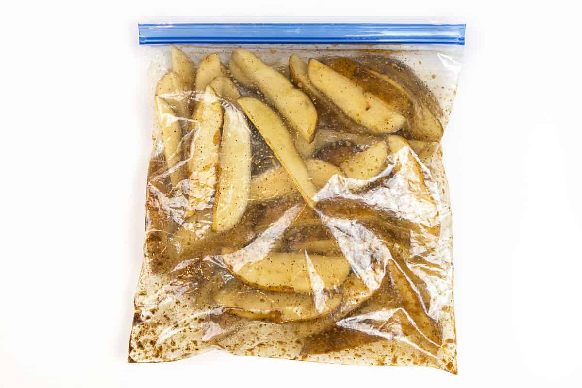 Put potato wedges into a zip lock bag with the seasonings.