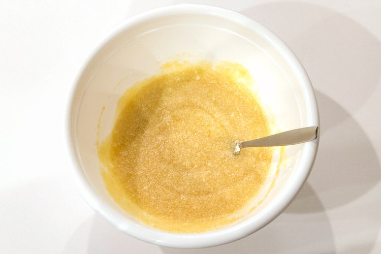 Applesauce is added to the shortening, sugar, and eggs.