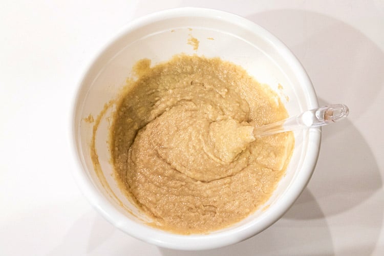 The flour mixture is added to the applesauce mixture.