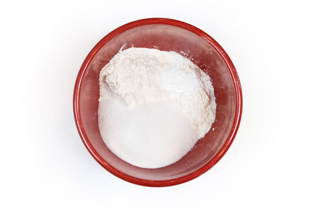 All-purpose flour, granulated sugar, baking powder, and table salt in a bowl.