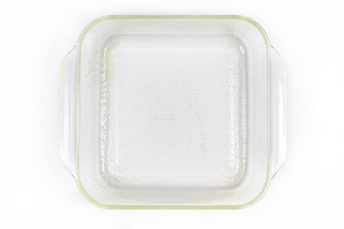 Spray an eight by eight inch square baking pan with non-stick cooking spray.