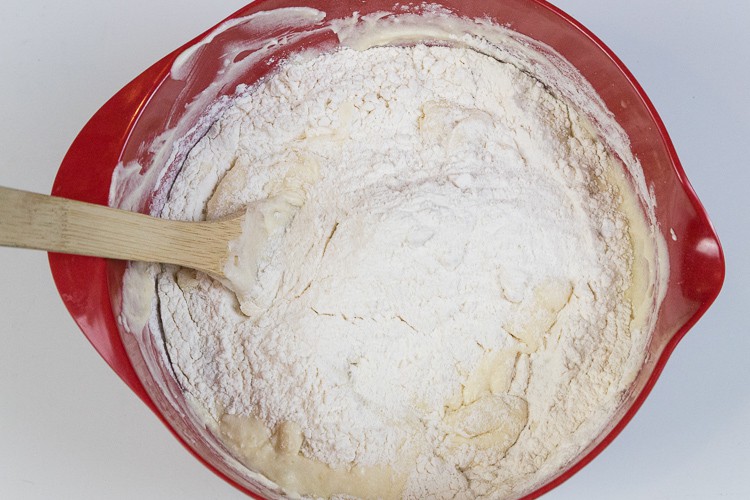 The remaining flour mixture is added to the banana bread mixture.