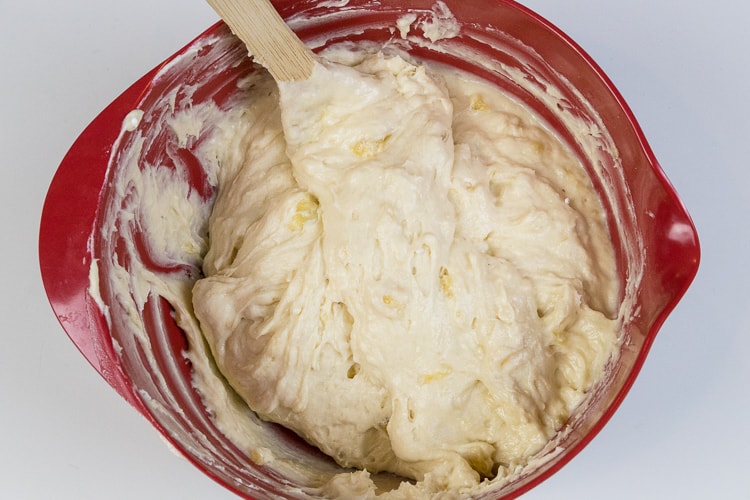 The banana bread batter is mixed thoroughly.