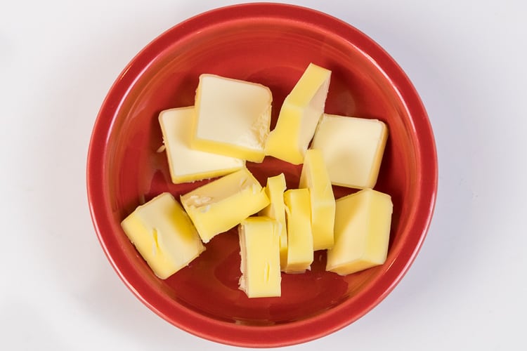Sliced butter in a bowl.
