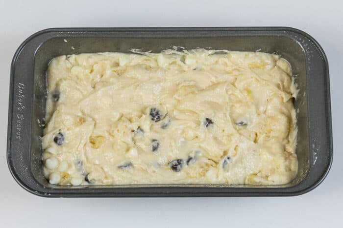 Chocolate chips and white chocolate chips are mixed in with the banana bread batter.