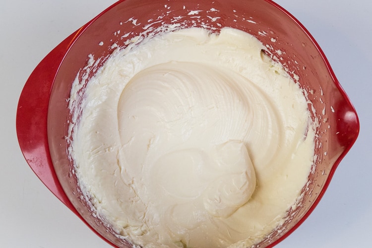 Two eggs are mixed thoroughly with the cream cheese mixture.