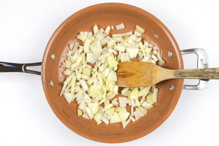 Put the chopped onion in a frying pan with one tablespoon of olive oil. Cook for five minutes.