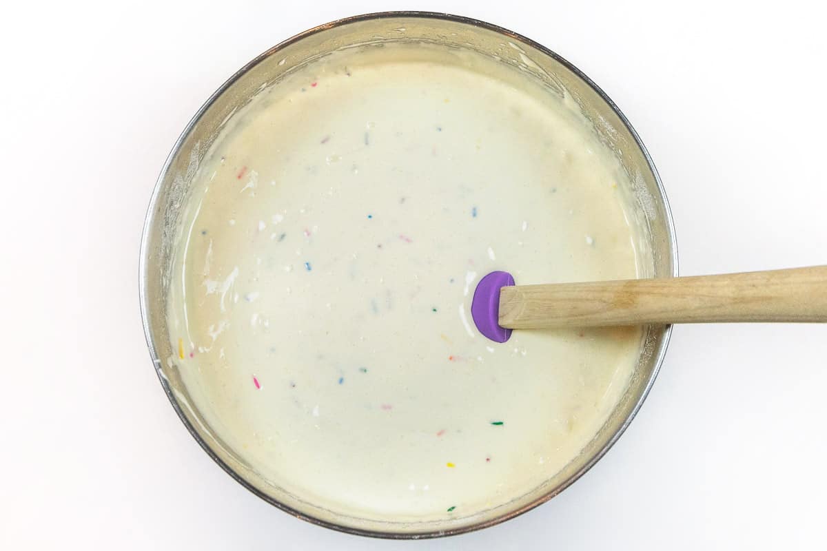 The cake batter is mixed well with the sprinkles.