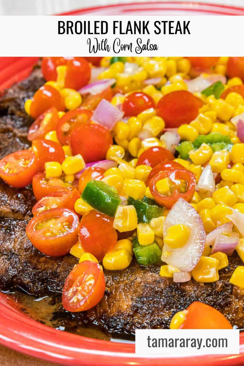 Flank steak on a plate topped with roasted corn salsa.