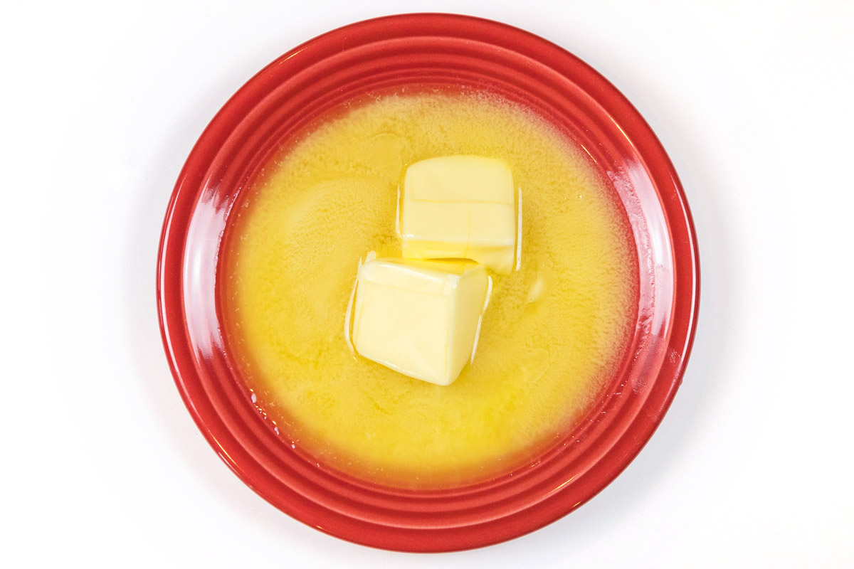 Soften one-half cup of butter in the microwave for about ten to twenty seconds. Please keep an eye on the butter while it is in the microwave.