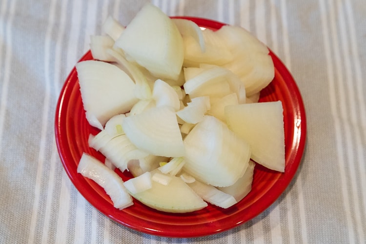 Sliced onions on a plate.