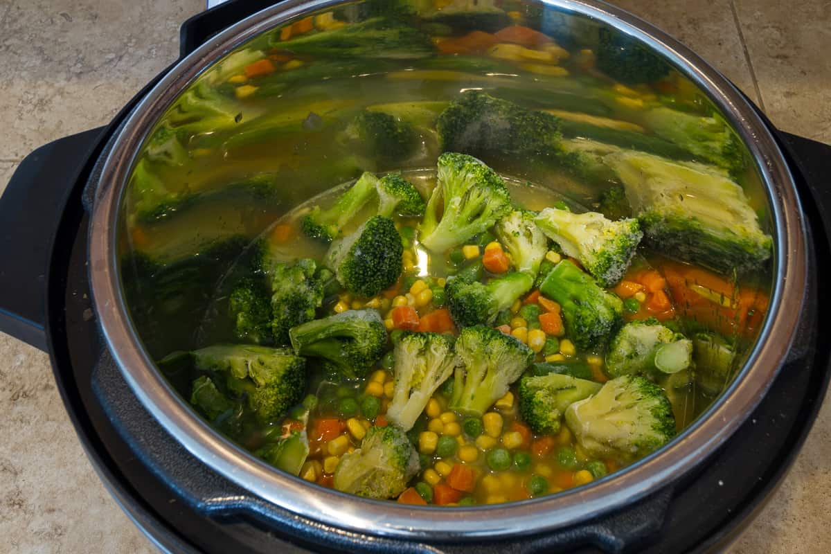 Broccoli and mixed vegetables are added.