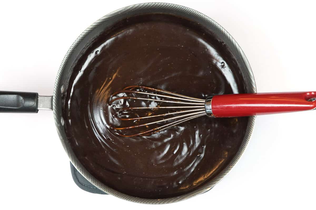 Thickened chocolate filling in a saucepan.