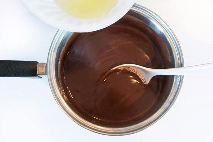 Add the two beaten eggs whites to the chocolate pudding mixture.