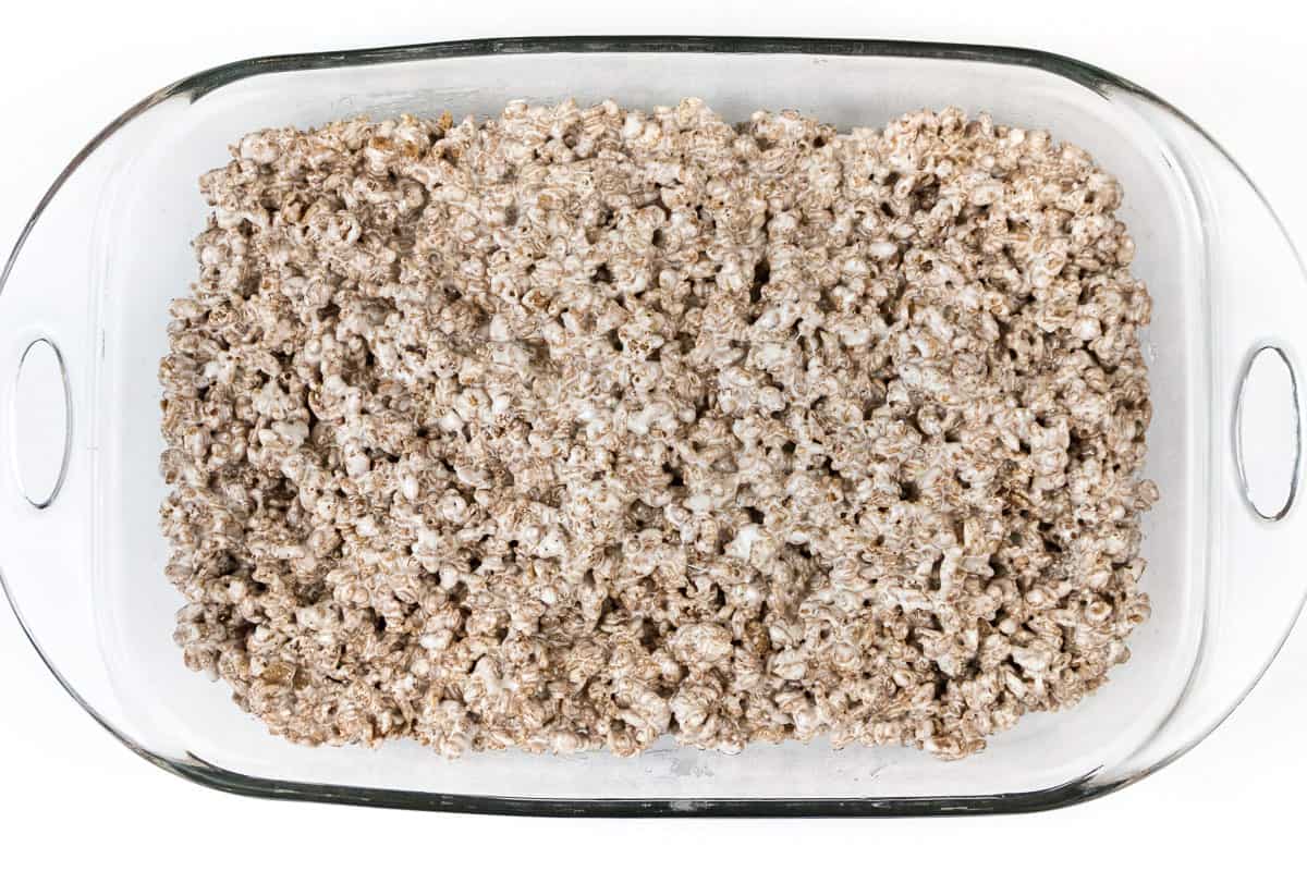 Spread the Cocoa Krispie Treats into the baking dish.