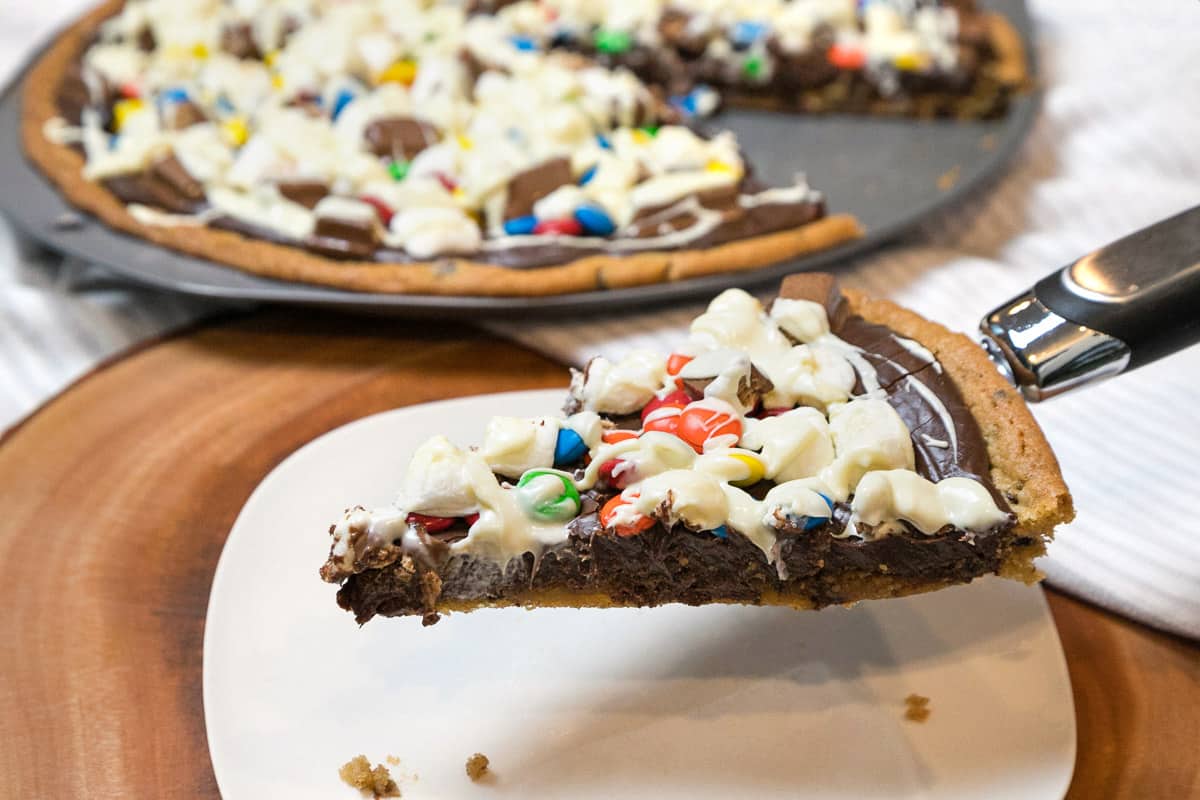 A slice of cookie pizza.