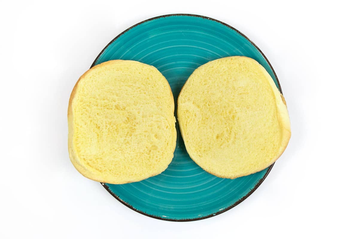 One sandwich bun on a plate.