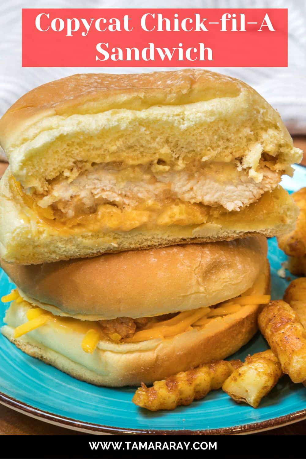 A close-up shot of a copycat Chick-fil-A sandwich cut in half on a plate.