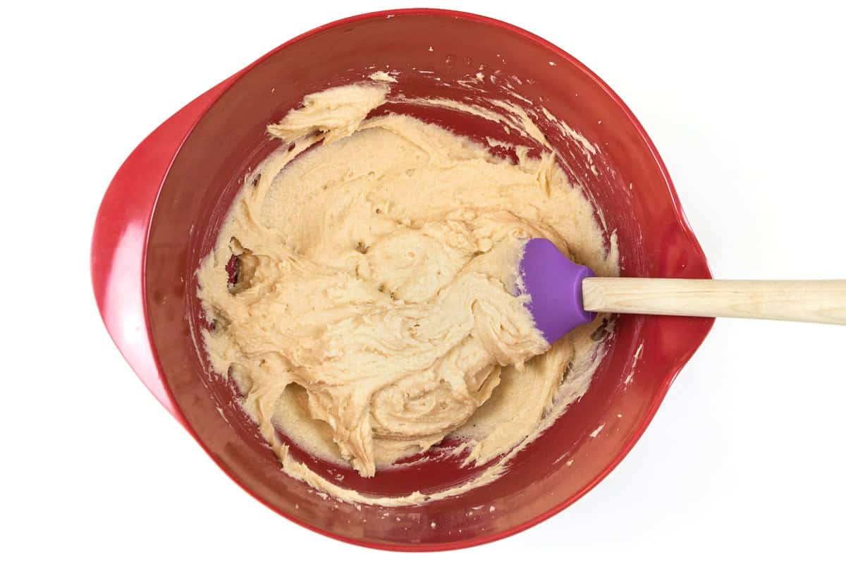The butter, light brown sugar, granulated sugar, and cream cheese are blended together.