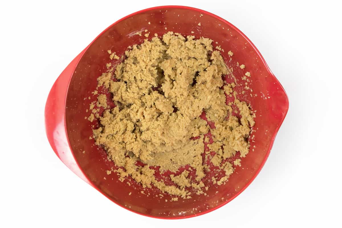 Softened butter, granulated sugar, and dark brown sugar are mixed in a bowl.